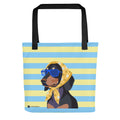 A tote bag with black handles, featuring a graphic of a black and tan dog wearing blue sunglasses and a yellow floral bandana, set against a light blue and pale yellow striped background. The brand name 'Untied Nations' is printed in the bottom left corner.