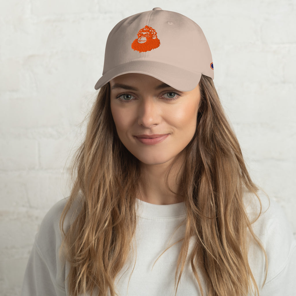 Woman wearing a beige cap with a logo on a white background