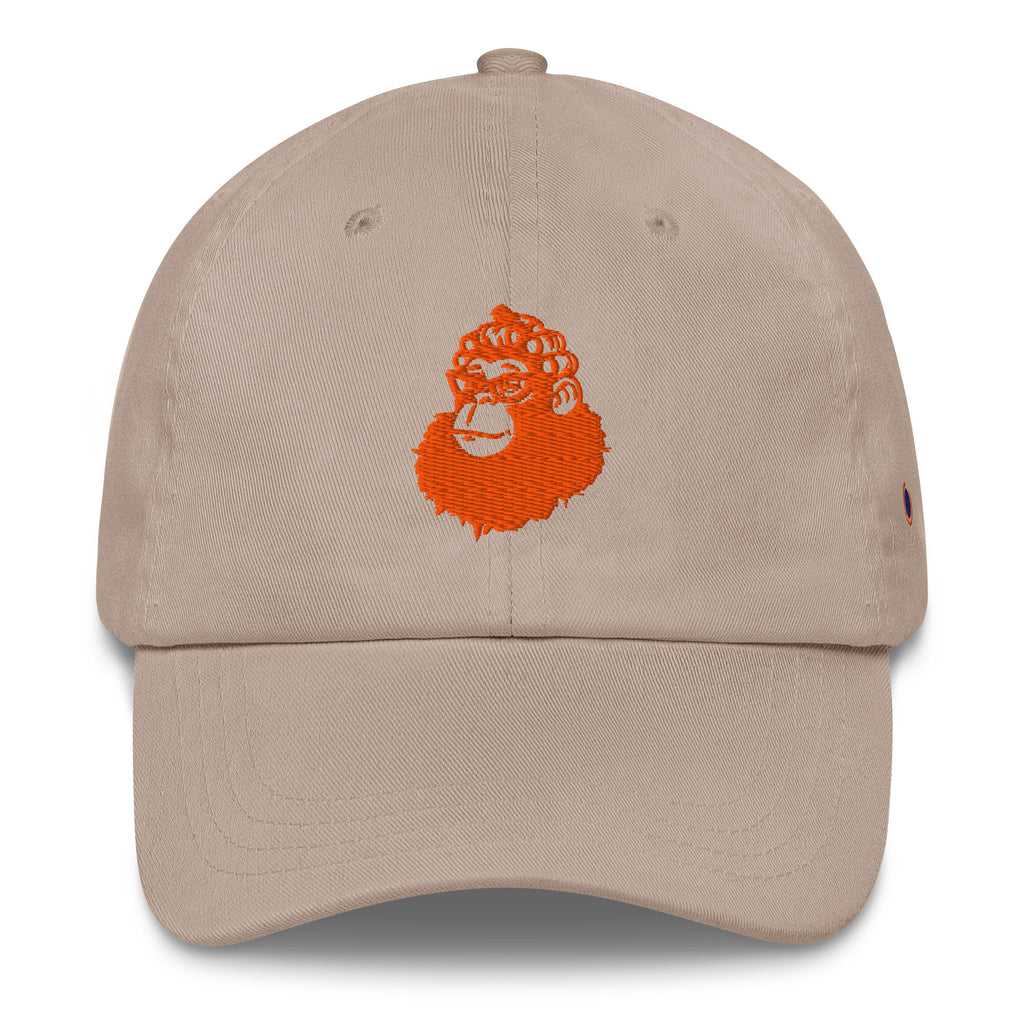 A beige baseball cap featuring an embroidered orange gorilla head logo on the front, set against a plain white background.