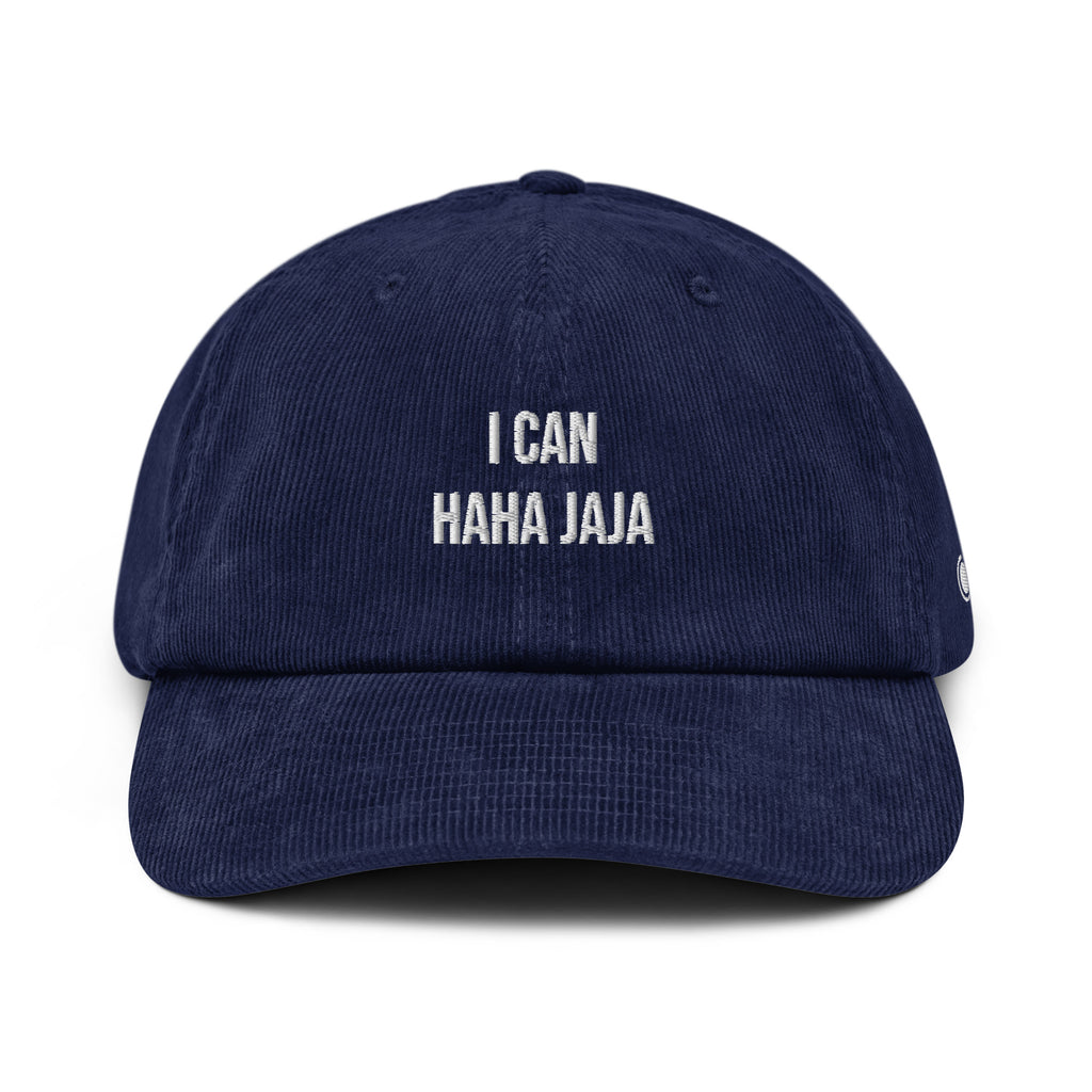 A navy blue corduroy baseball cap with white embroidered text reading 'I CAN HAHA JAJA' on the front, shown against a plain white background.