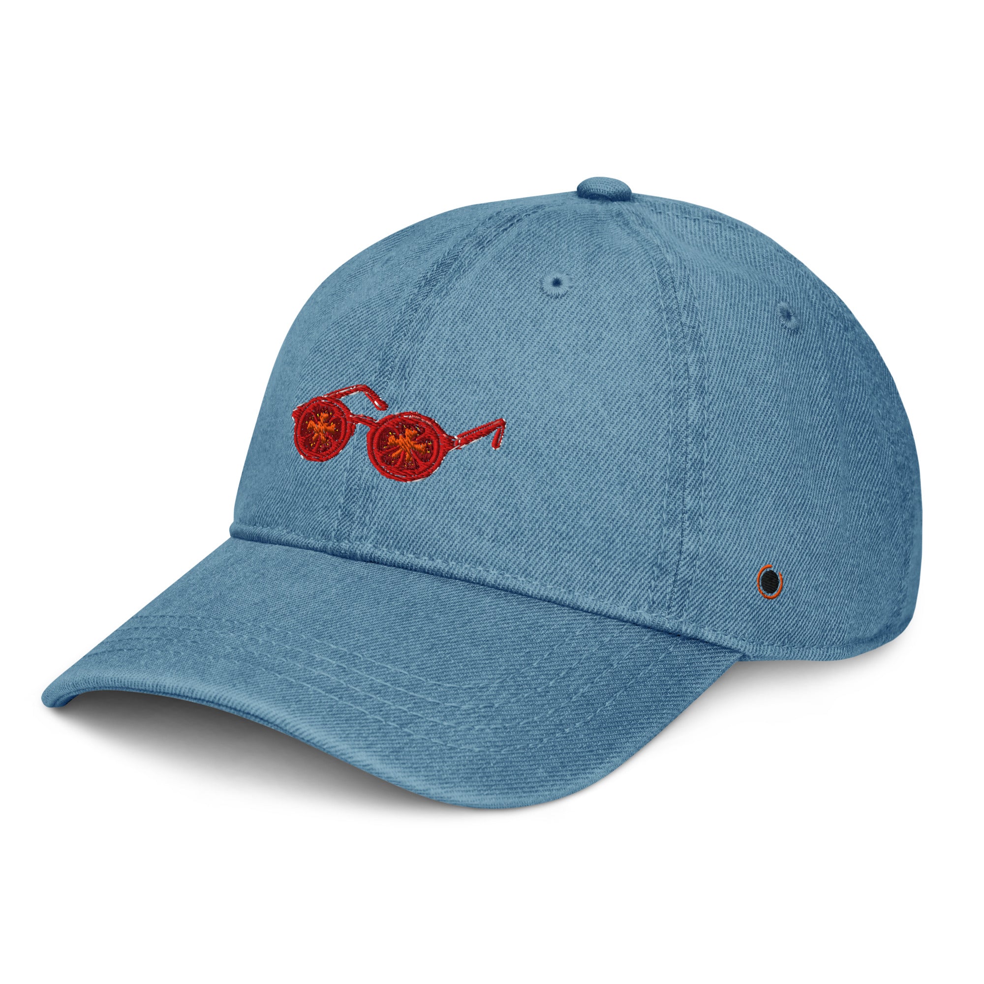 A light blue denim baseball cap featuring a red embroidered pair of sunglasses on the front panel, set against a plain white background.