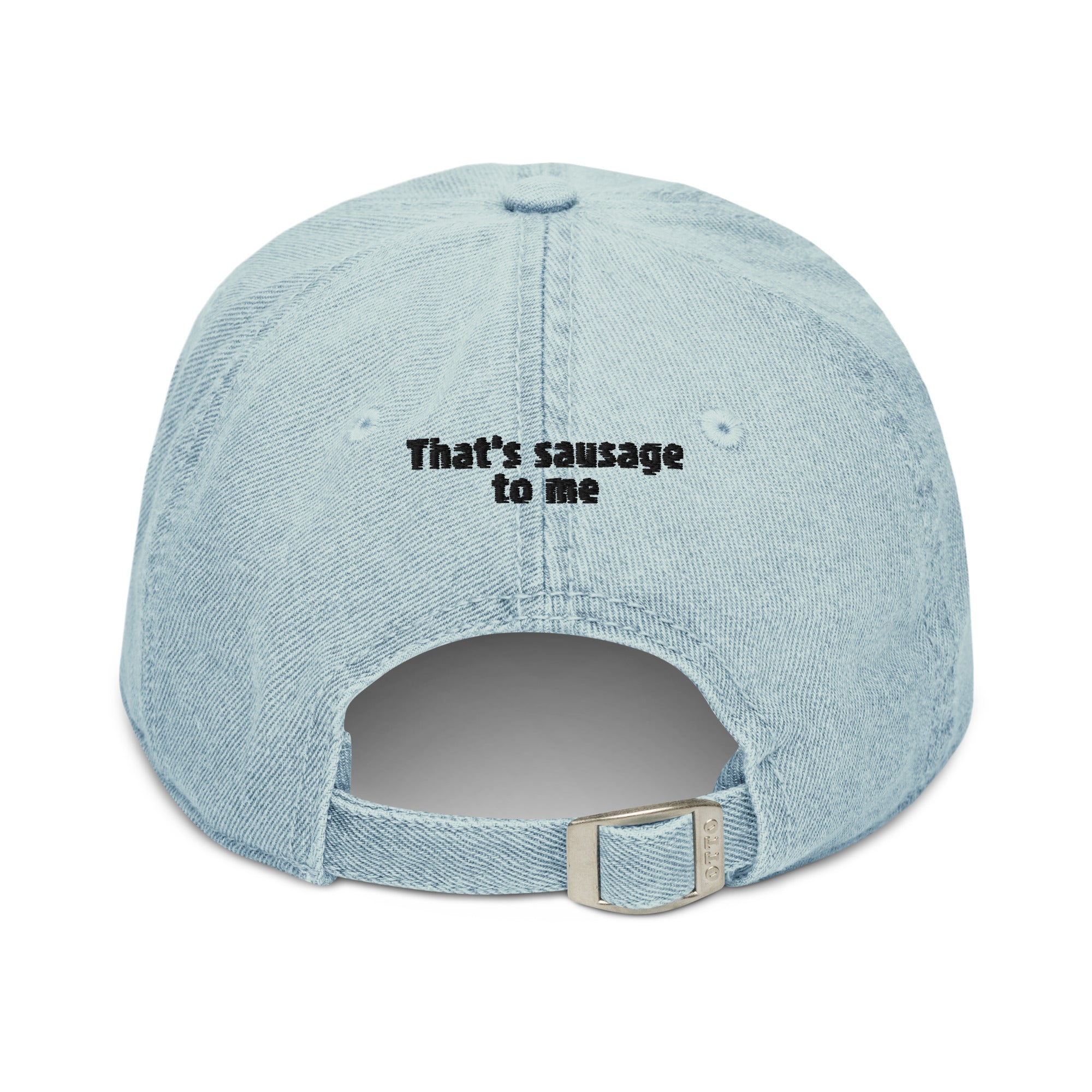 A light blue denim baseball cap shown from the back, featuring the black embroidered text 'That's sausage to me' on the crown and a silver metal adjustment buckle.
