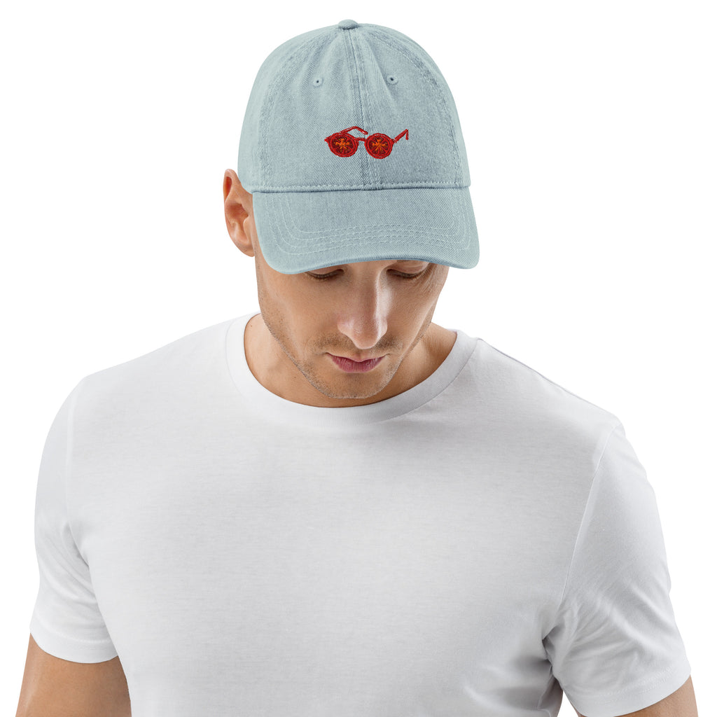 Man wearing a light blue cap and white t-shirt on a white background