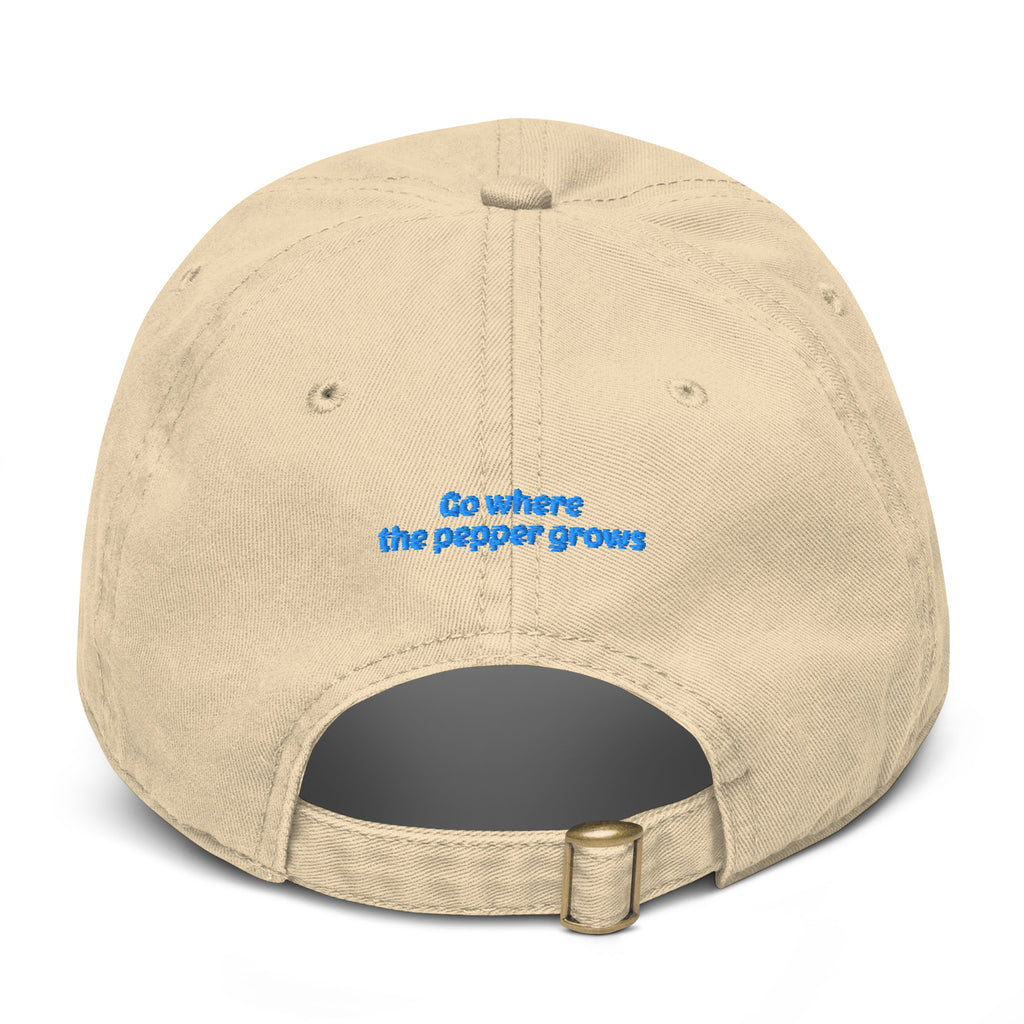 Beige cap with a logo on the back against a white background