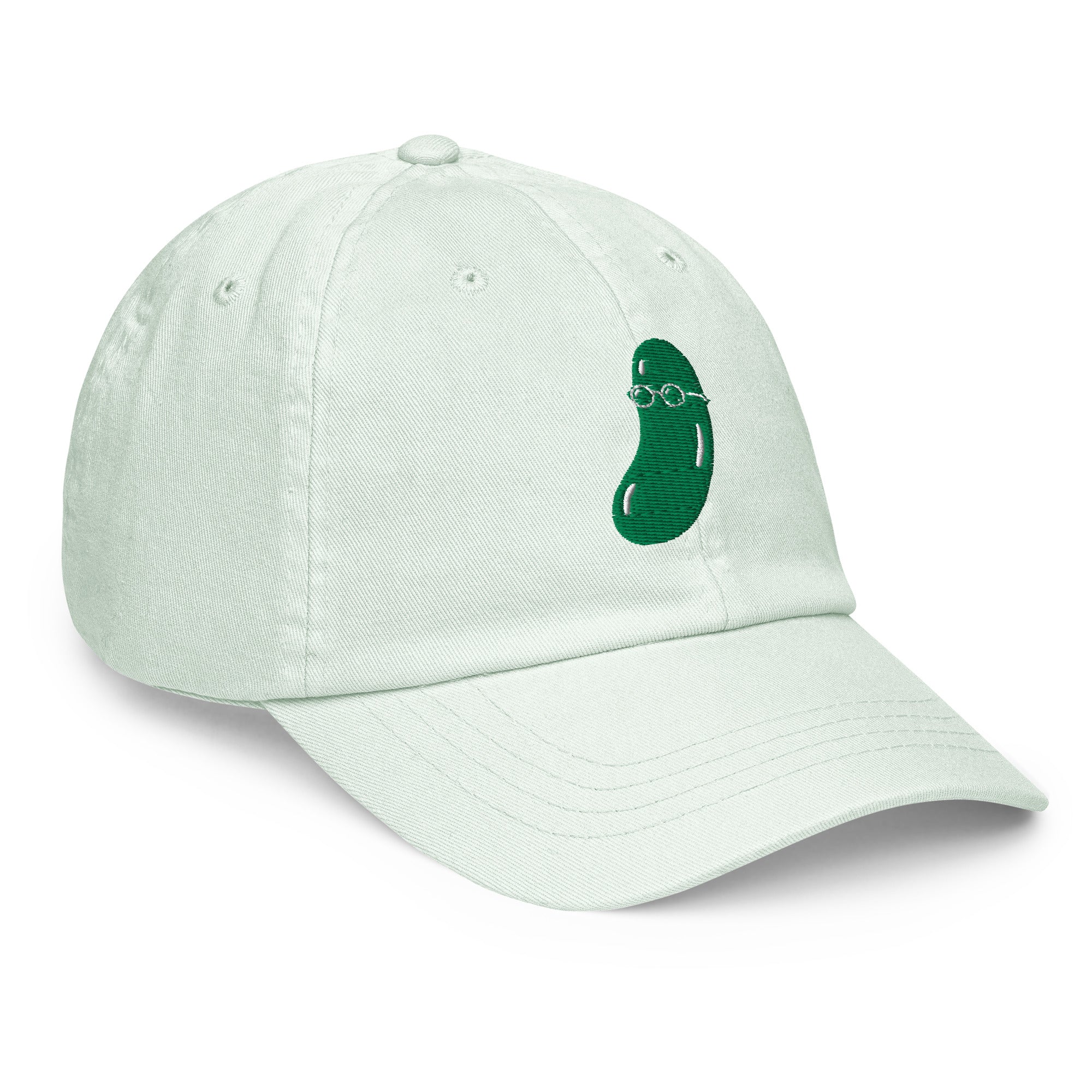 A light mint green cotton baseball cap featuring a small embroidered green cucumber wearing glasses on the side, set against a plain white background.
