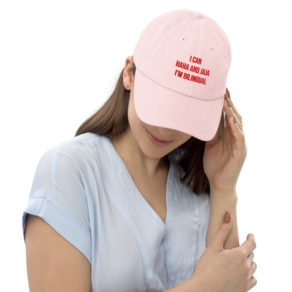 Person wearing a pink cap with red text on a white background