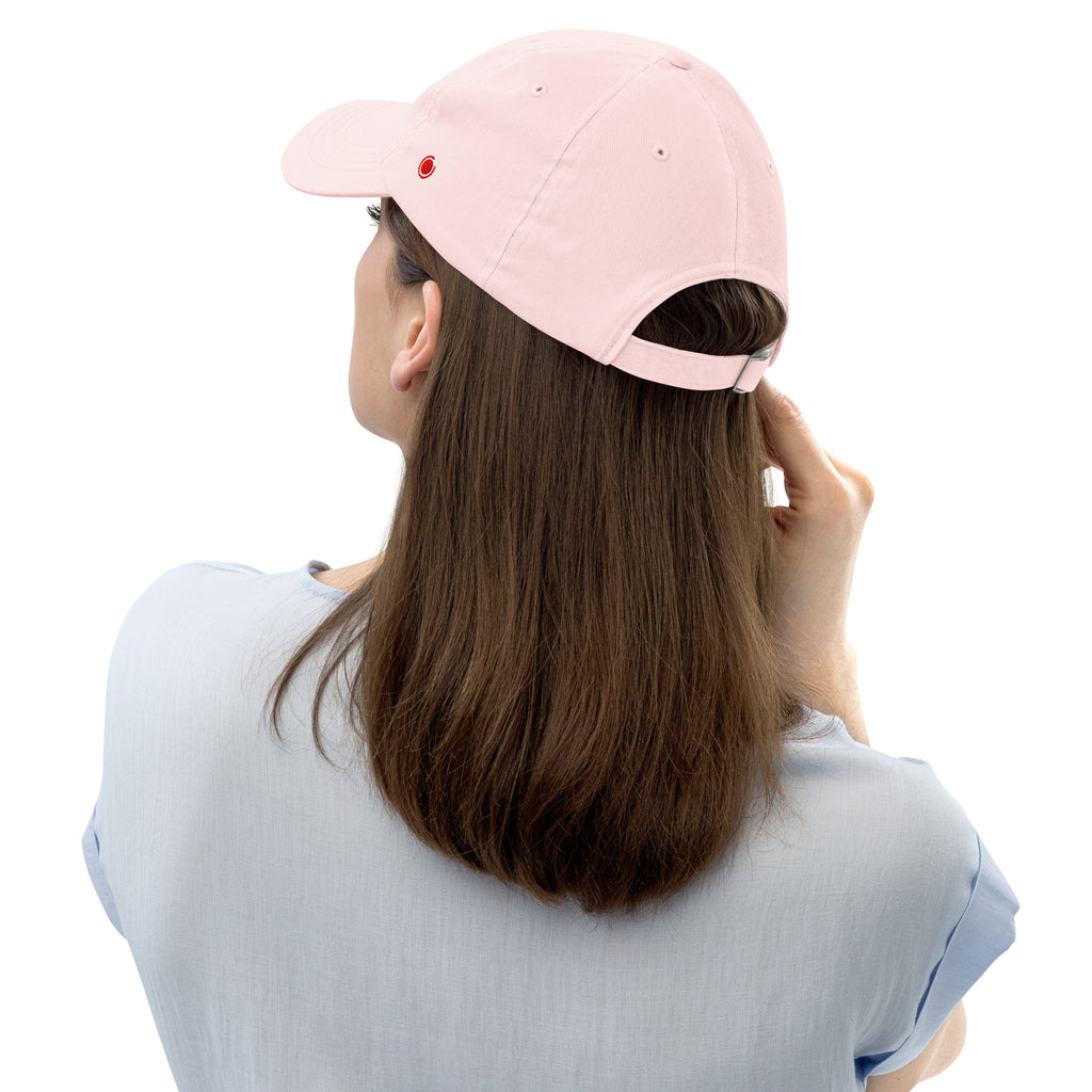 Person wearing a pink baseball cap from behind on a white background