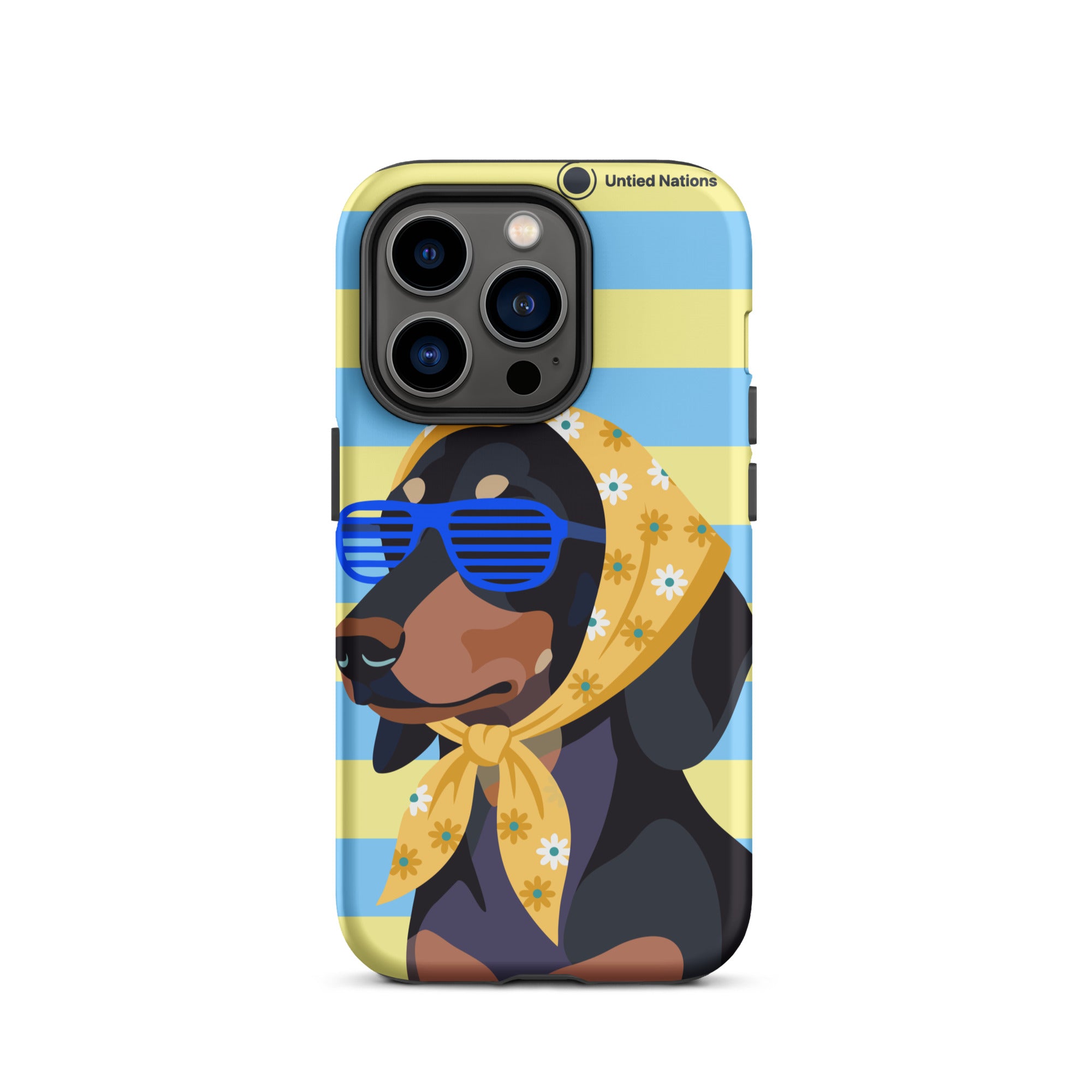 A phone case featuring a stylized illustration of a black and tan dog wearing blue sunglasses and a yellow floral bandana, set against a light blue and yellow striped background. The case has a black camera bumper and the text 'United Nations' near the top.