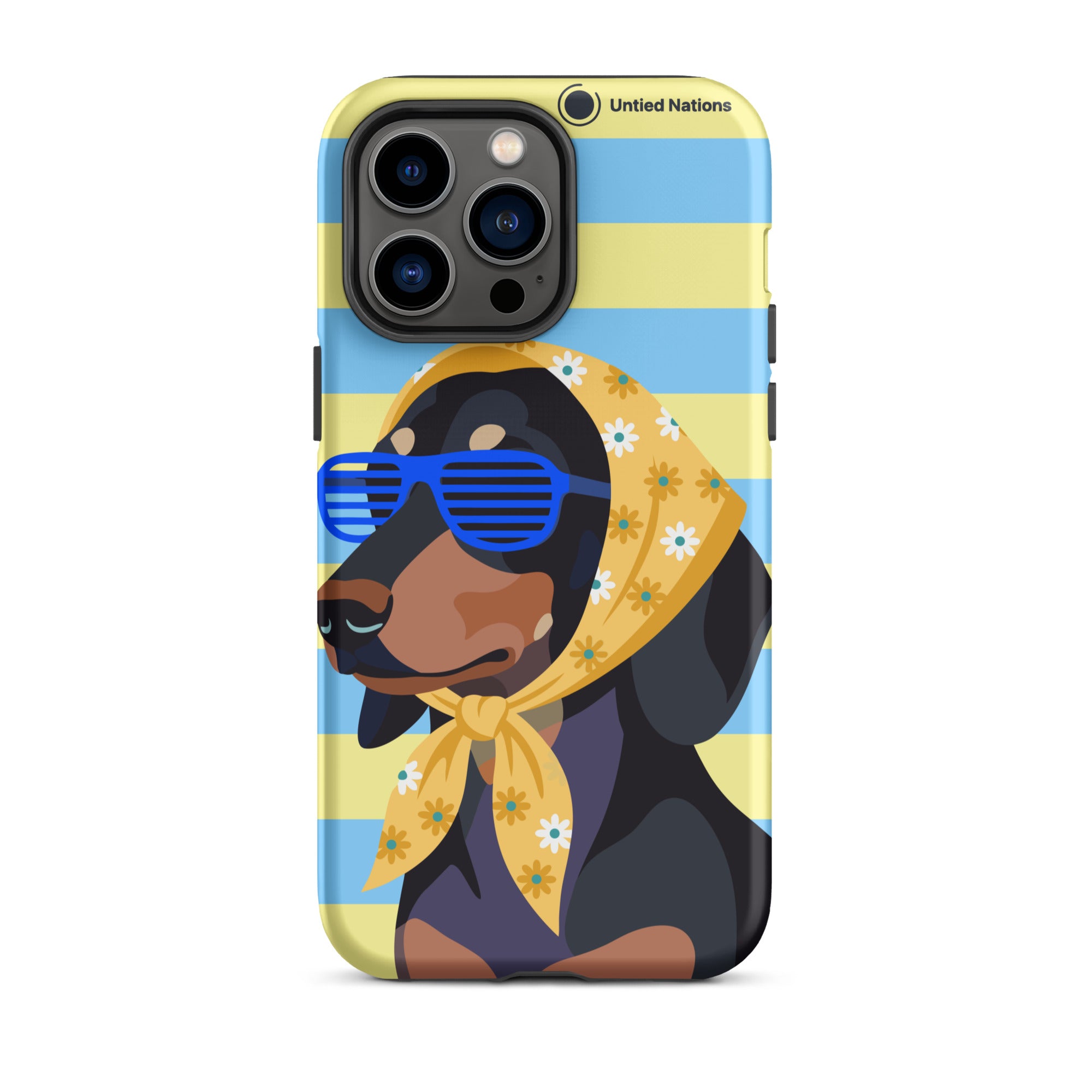 A phone case featuring a stylized illustration of a black and tan dog wearing blue sunglasses and a yellow floral bandana, set against a light blue and yellow striped background. The case has a black camera bumper and the text 'United Nations' printed near the top right.