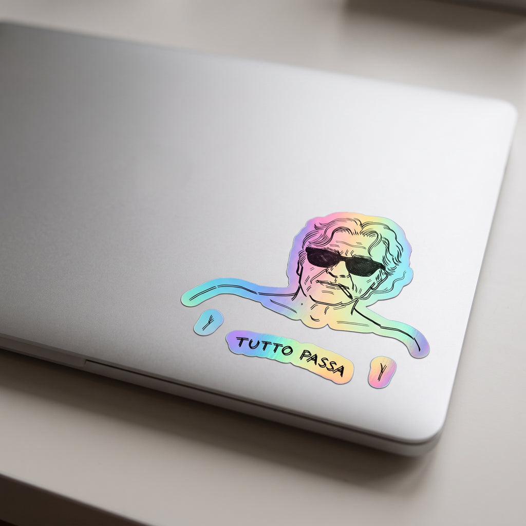 tutto passa holographic sticker on laptop