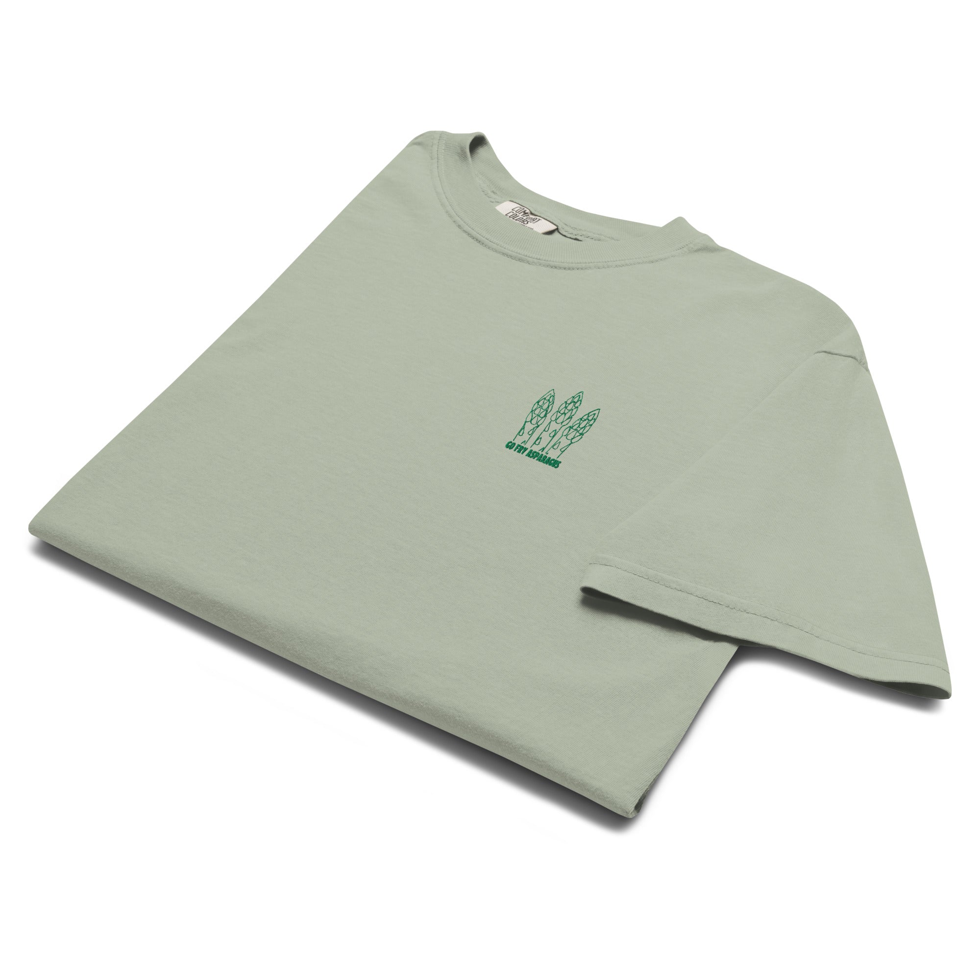 Folded sage green t-shirt with an embroidered asparagus graphic and the text "Go fry asparagus" on the left chest