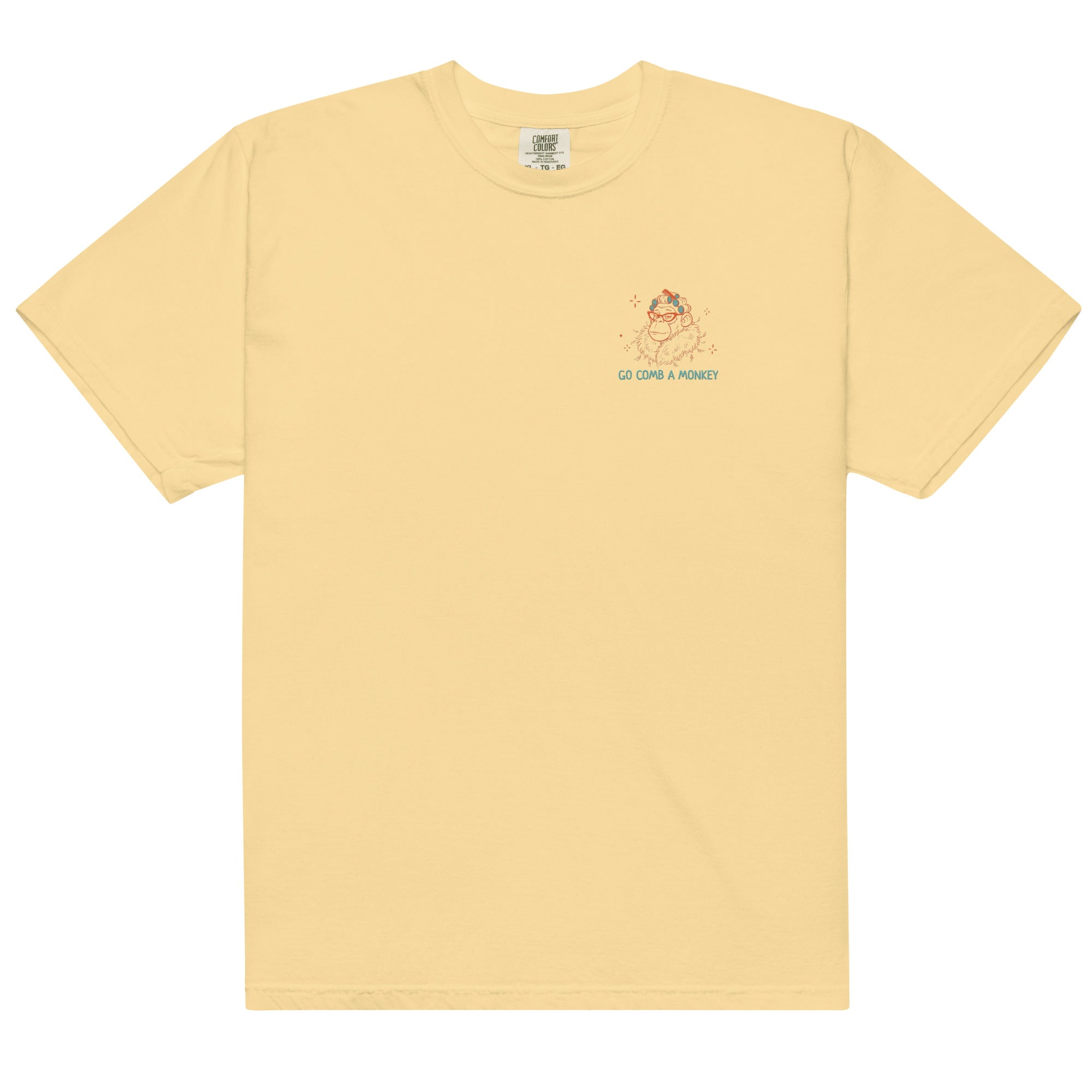 Yellow short-sleeve t-shirt with a small graphic on the left chest showing a cartoon monkey and the text 'GO COMB A MONKEY' in teal and orange, displayed on a clean white background.