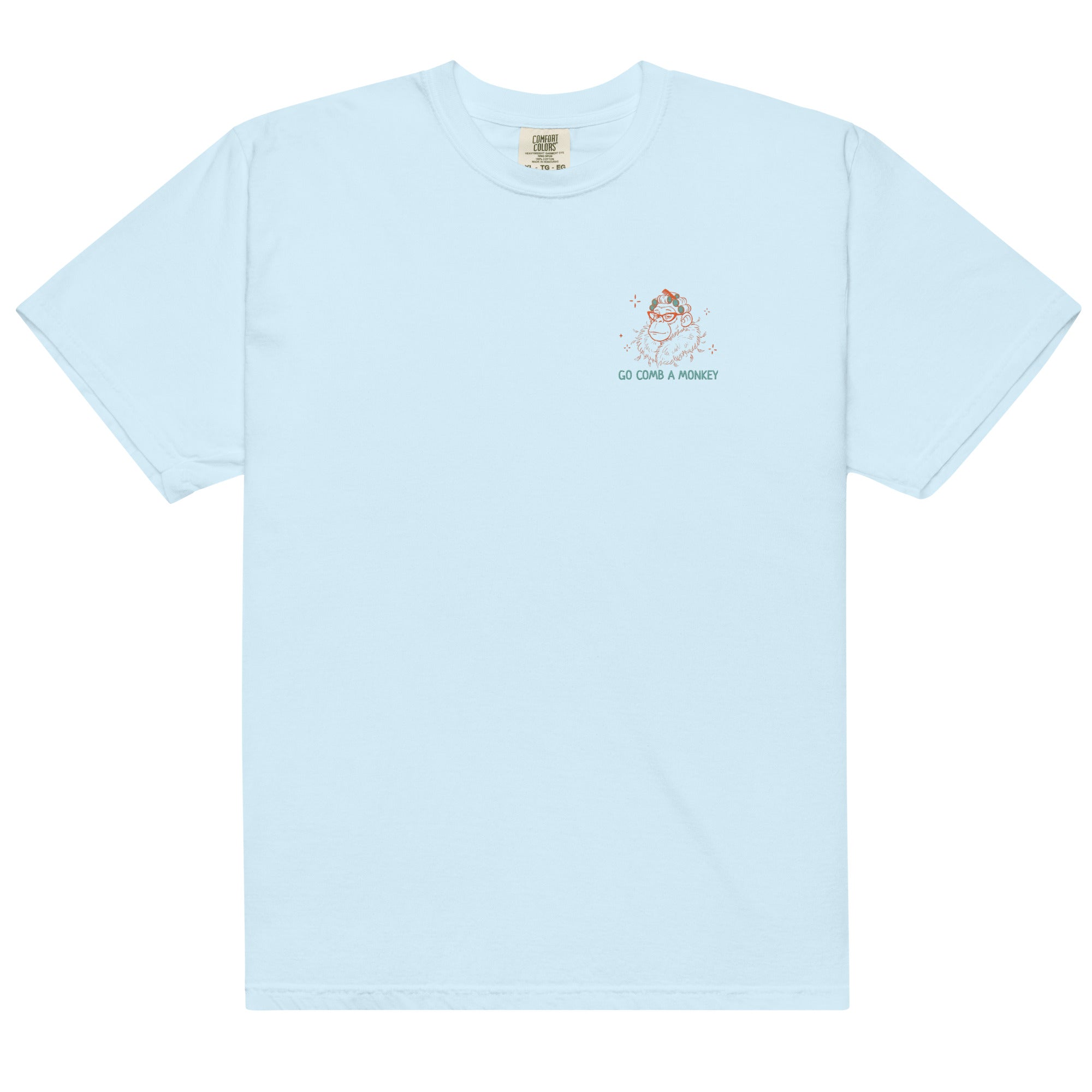 A light blue short-sleeve crewneck t-shirt with a small graphic on the left chest showing a cartoon monkey and the text 'GO COMB A MONKEY'.
