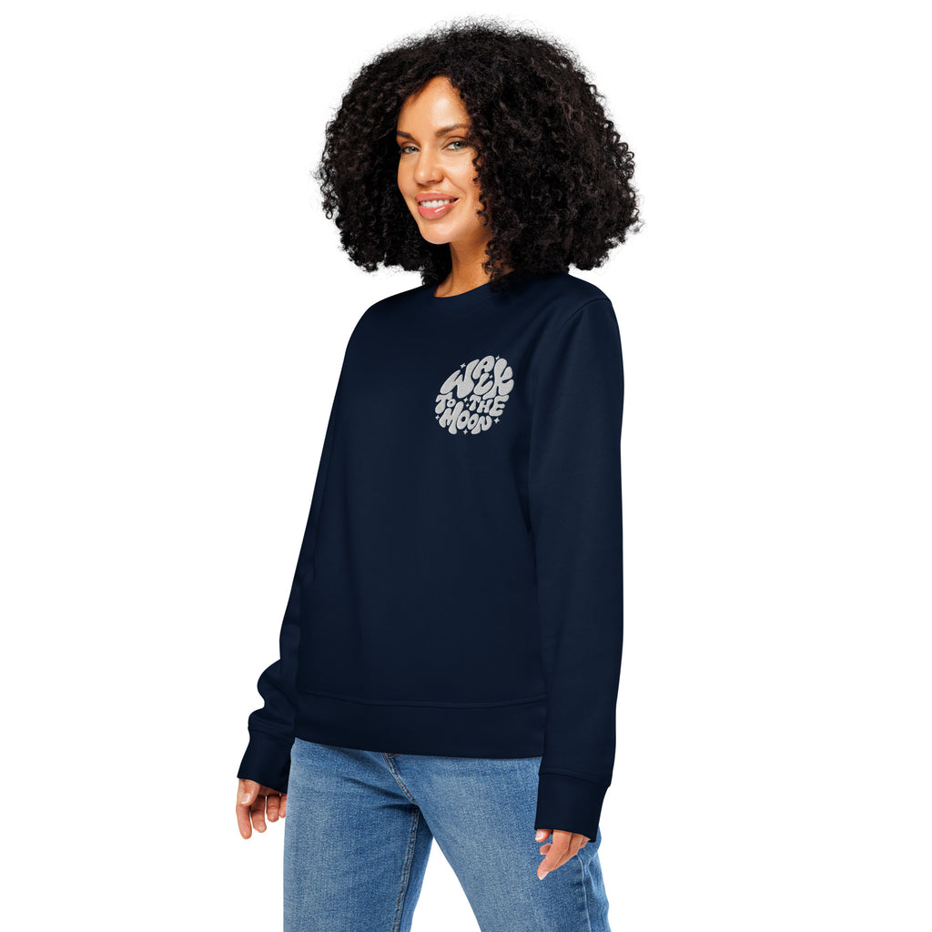 Woman wearing a navy blue sweatshirt with text on a white background