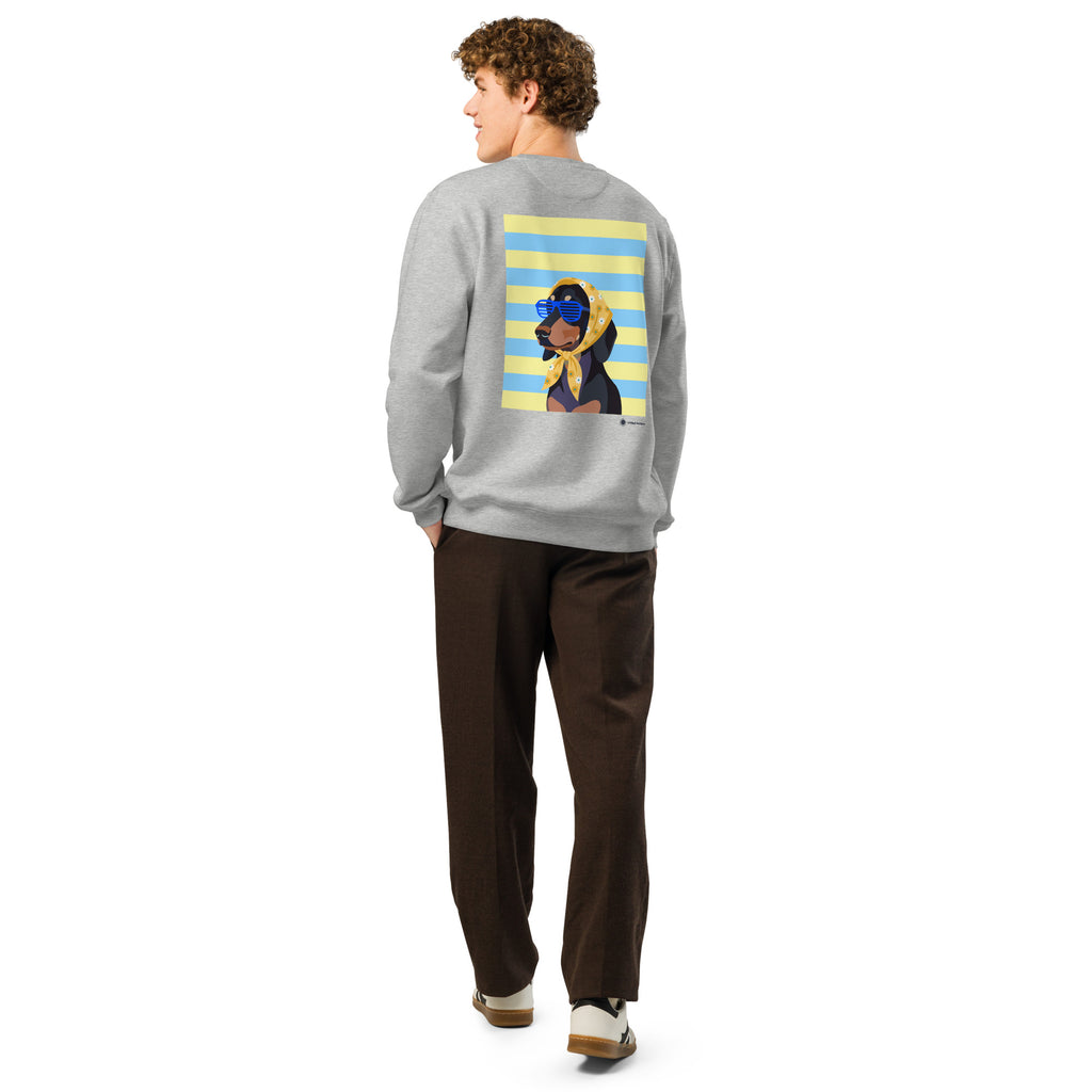 A man wearing a light gray crewneck sweatshirt with a graphic print of a dog on a blue and yellow striped background, paired with dark brown pants and white sneakers, shown from a rear three-quarter view against a white studio background.