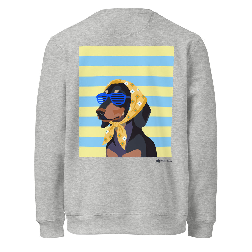 A heather gray crewneck sweatshirt shown from the back, featuring a large graphic print of a black and tan dog wearing a yellow bandana and blue sunglasses, set against a background of yellow and light blue horizontal stripes.