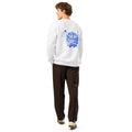A man shown from the back wearing a white crewneck sweatshirt with a blue graphic print on the back, paired with dark brown pants and white sneakers, against a plain white background.