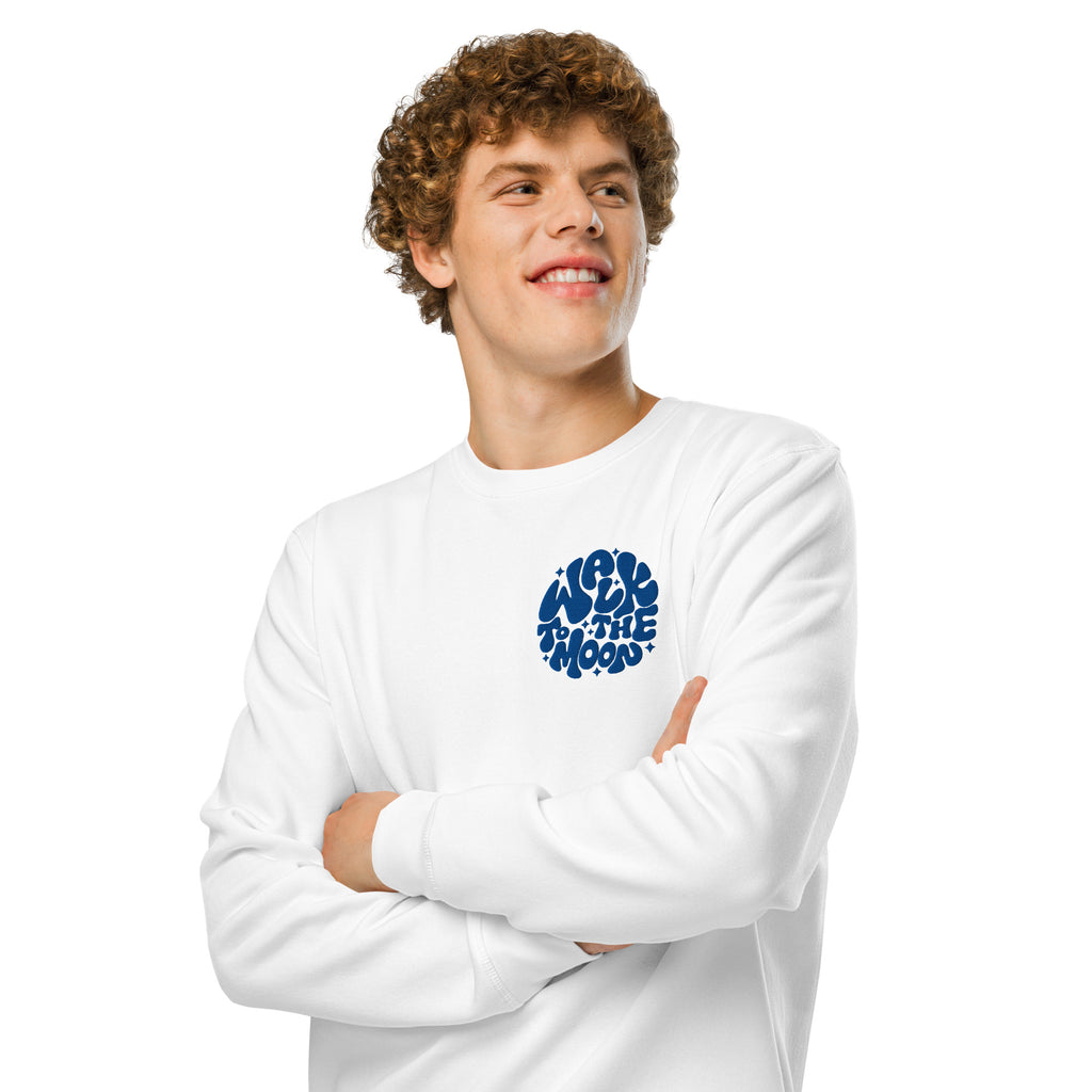 man in white sweater with blue embroidery