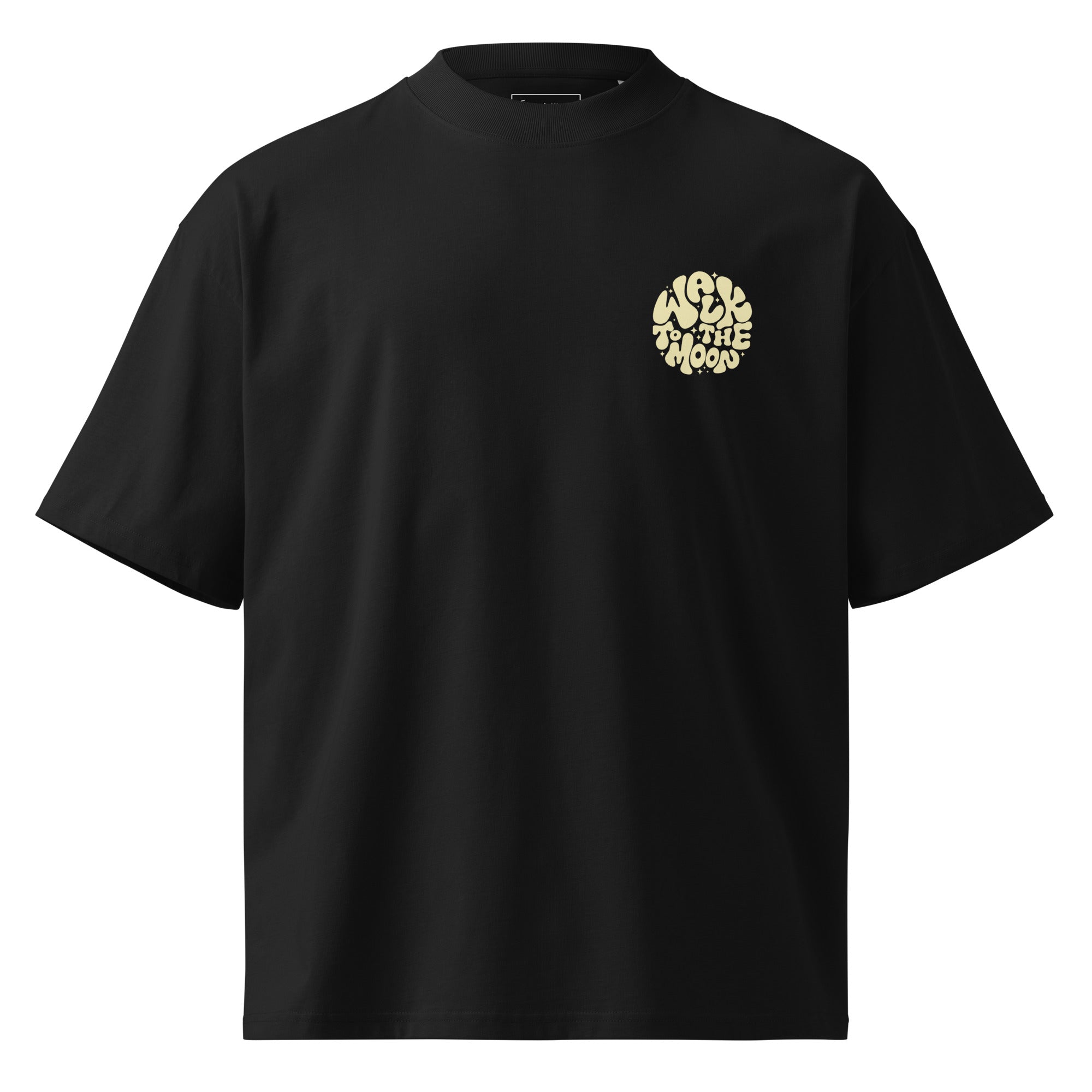 A black short-sleeve crewneck t-shirt with a circular beige graphic on the left chest containing the text 'WALK TO THE MOON'.