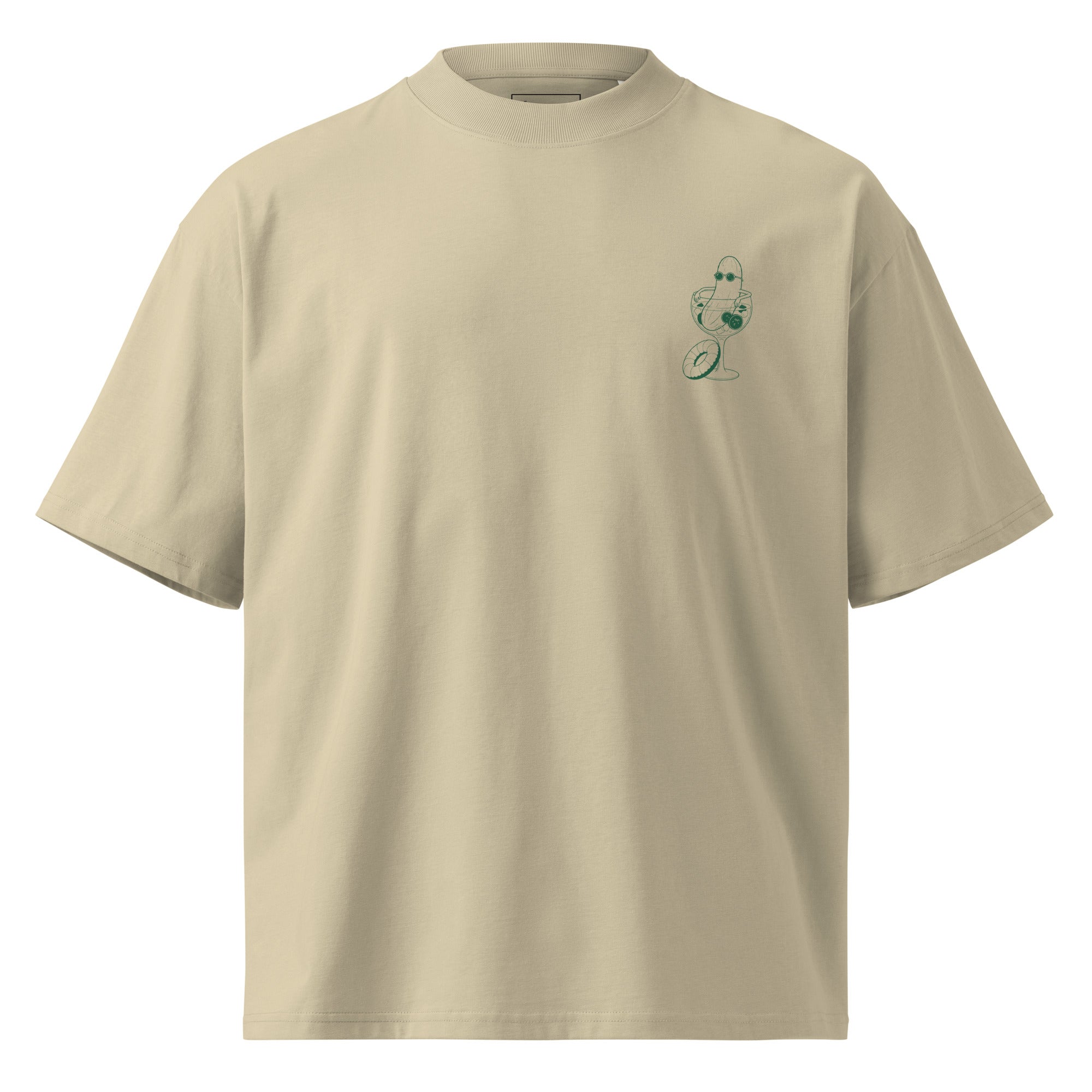 A beige short-sleeve crewneck t-shirt with a small green illustration of a cucumber wearing sunglasses and sitting in a cocktail glass printed on the left chest.
