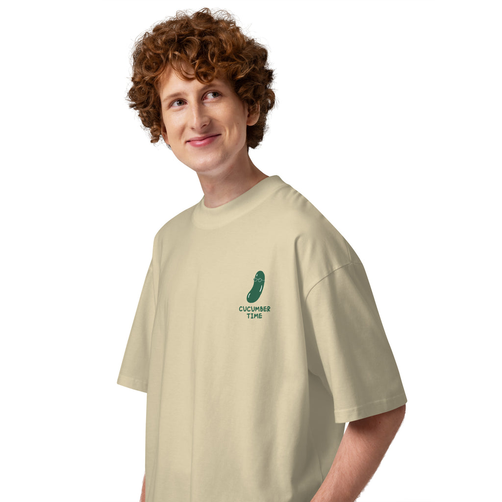 Person wearing a beige t-shirt with a logo on a white background