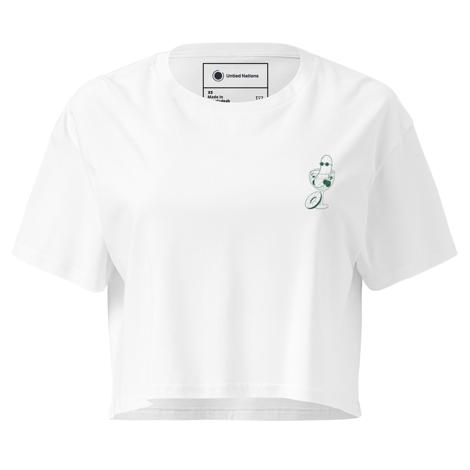A white crop top with an illustration of a cucumber wearing sunglasses sitting in a cocktail glass printed on the left chest.