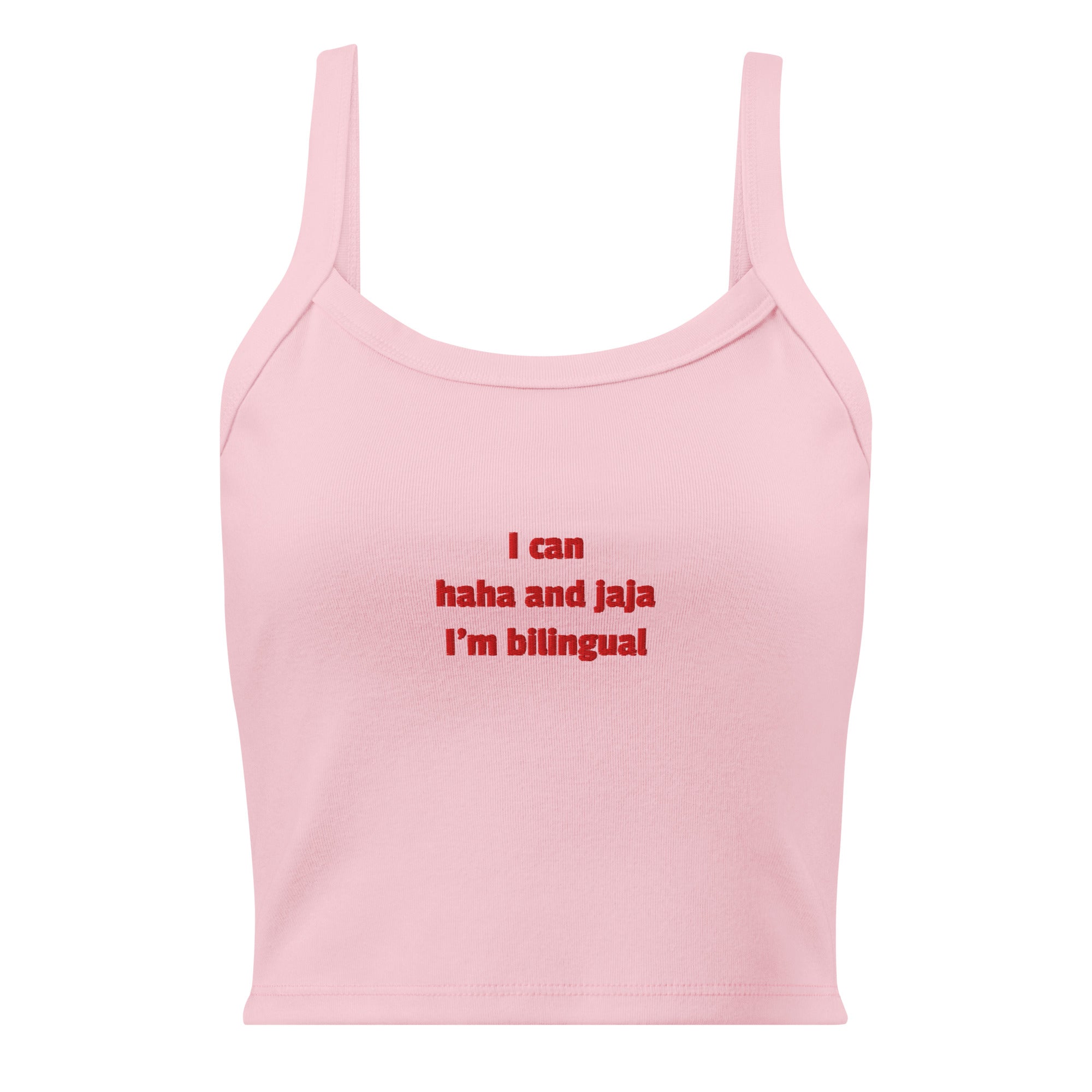 A light pink sleeveless crop top with thin straps and red text on the chest that reads 'I can haha and jaja I'm bilingual'.